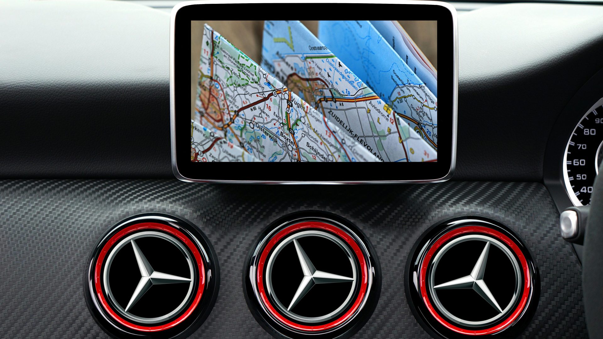 Close-up of a luxury car dashboard featuring a GPS navigation system displaying a road map.