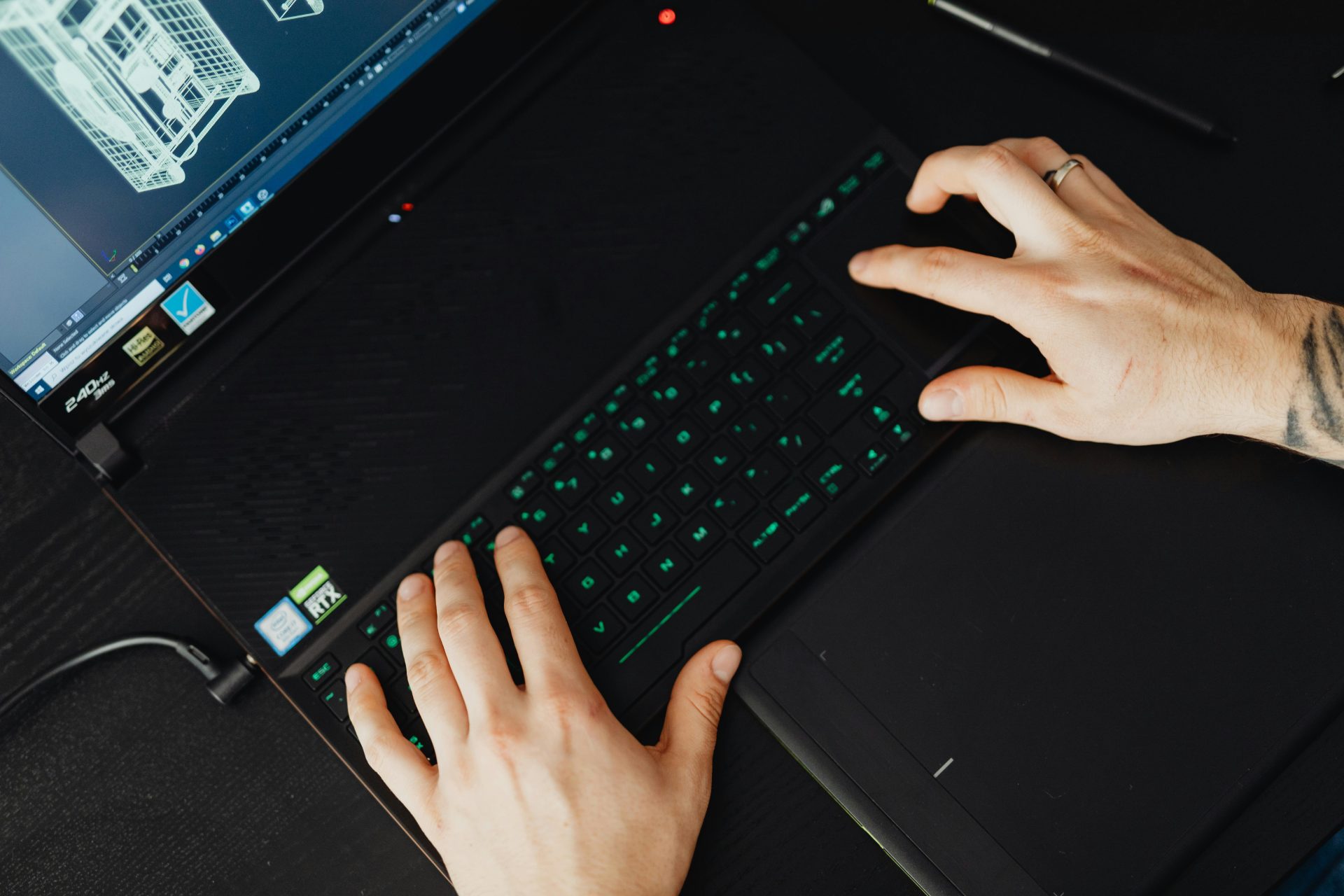 Hands typing on a laptop keyboard, ideal for tech and work themes.