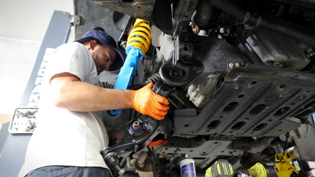 A man working on a car in a garage