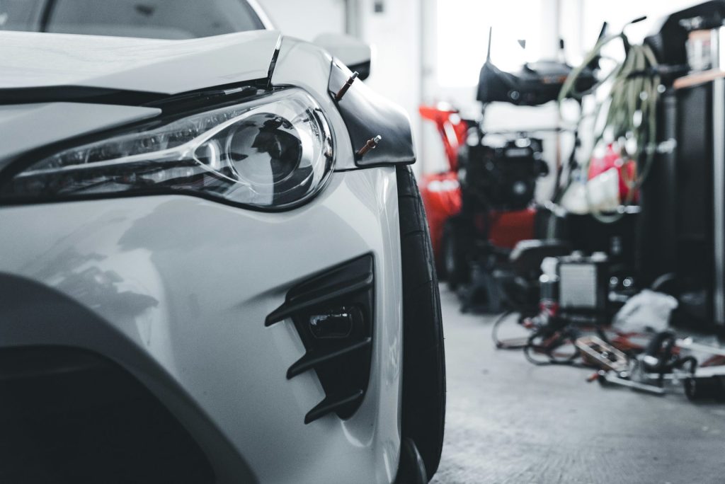 White sports car in a workshop