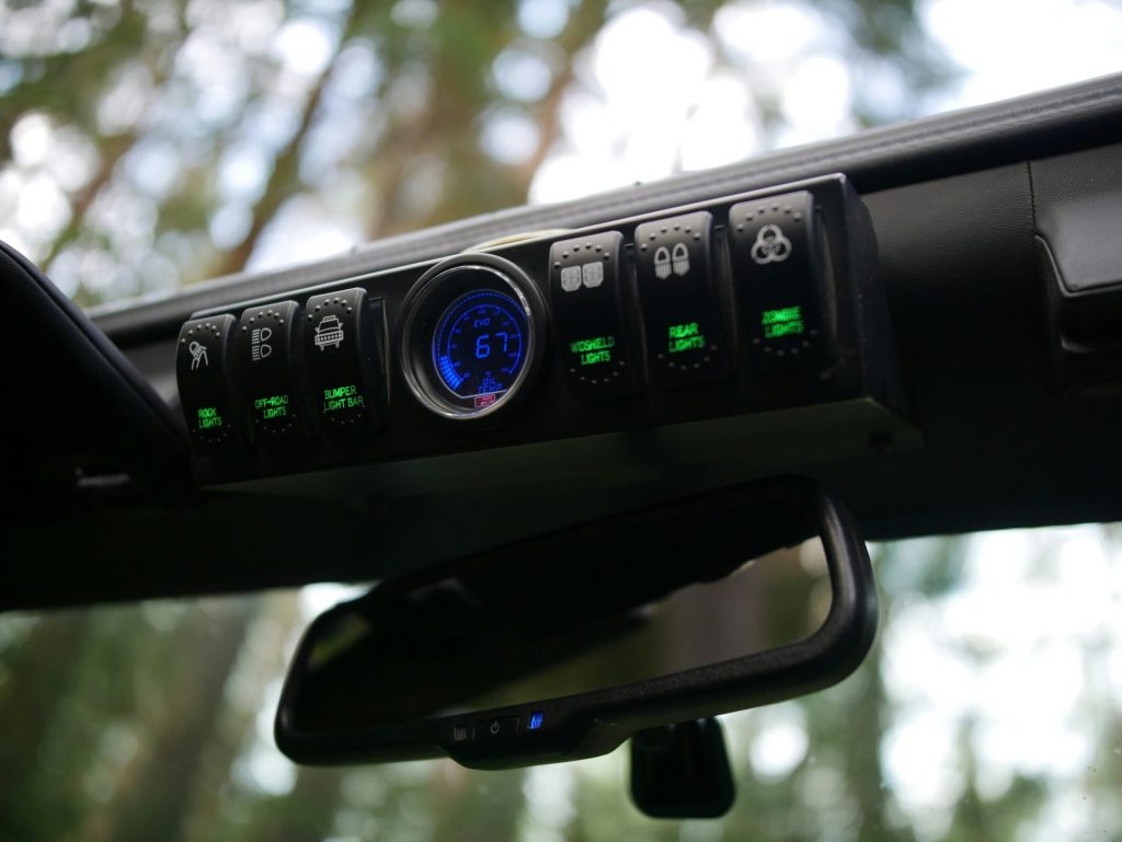 the dashboard of a car with a clock on it
